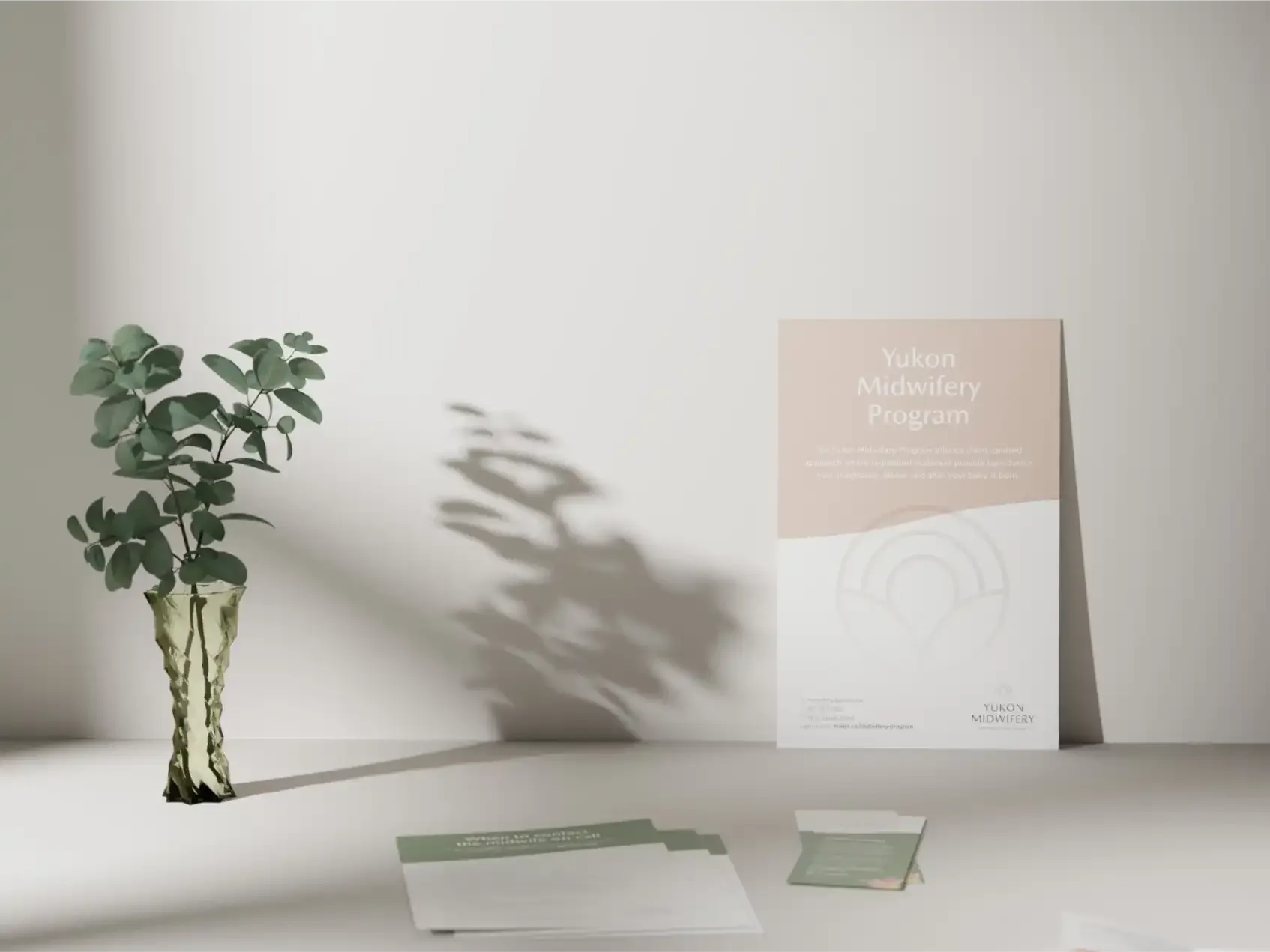 Yukon Midwifery Program poster and print materials designed by MBDC, featuring soft earth tones and minimal branding.